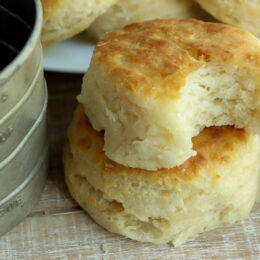 Golden 3-ingredient buttermilk biscuits brushed with melted butter and stacked