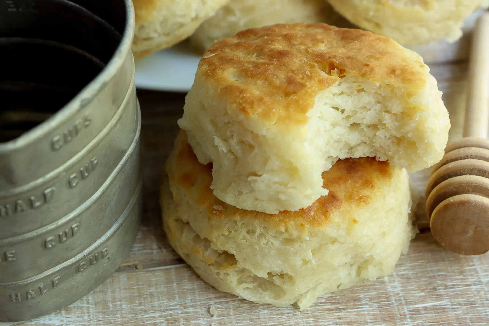 Golden 3-ingredient buttermilk biscuits brushed with melted butter and stacked
