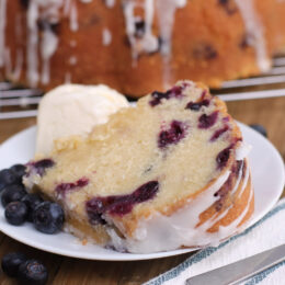 A slice of fresh blueberry pound cake on a plate