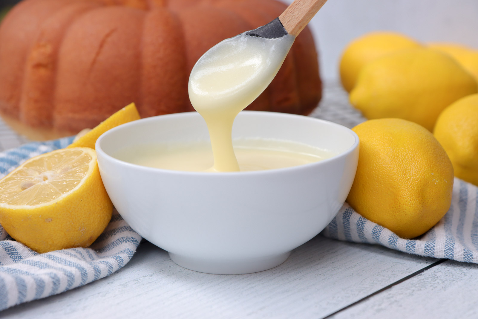 Lemon glaze coating a spoon