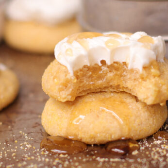 cornbread cookies stack on top of each other with frosting and honey