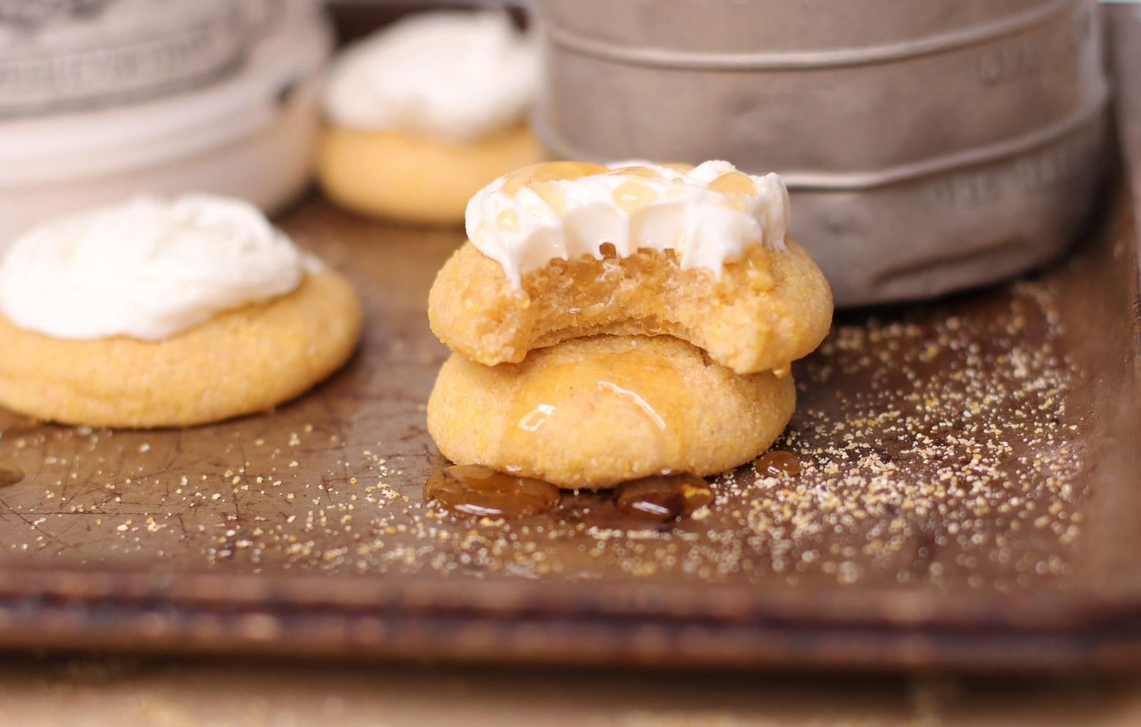 frosted cornbread cookies on a tray